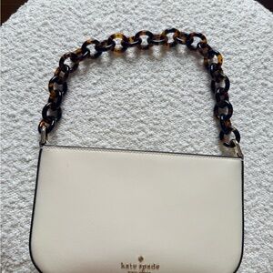 kate spade cream saffiano shoulder bag with tortoiseshell chain strap